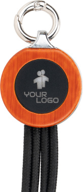 Logotrade werbemittel das Foto: 4-in-1-Kabel mit elighted-Logo im Holzgehäuse